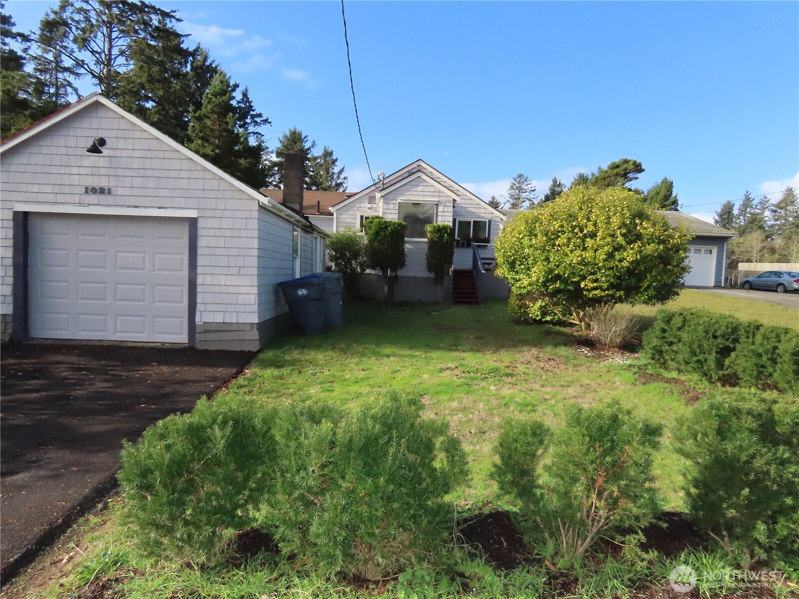 1021 South Forrest Street Westport, WA 98595 - Photo 2 of 29 a view of a house with a yard and pathway