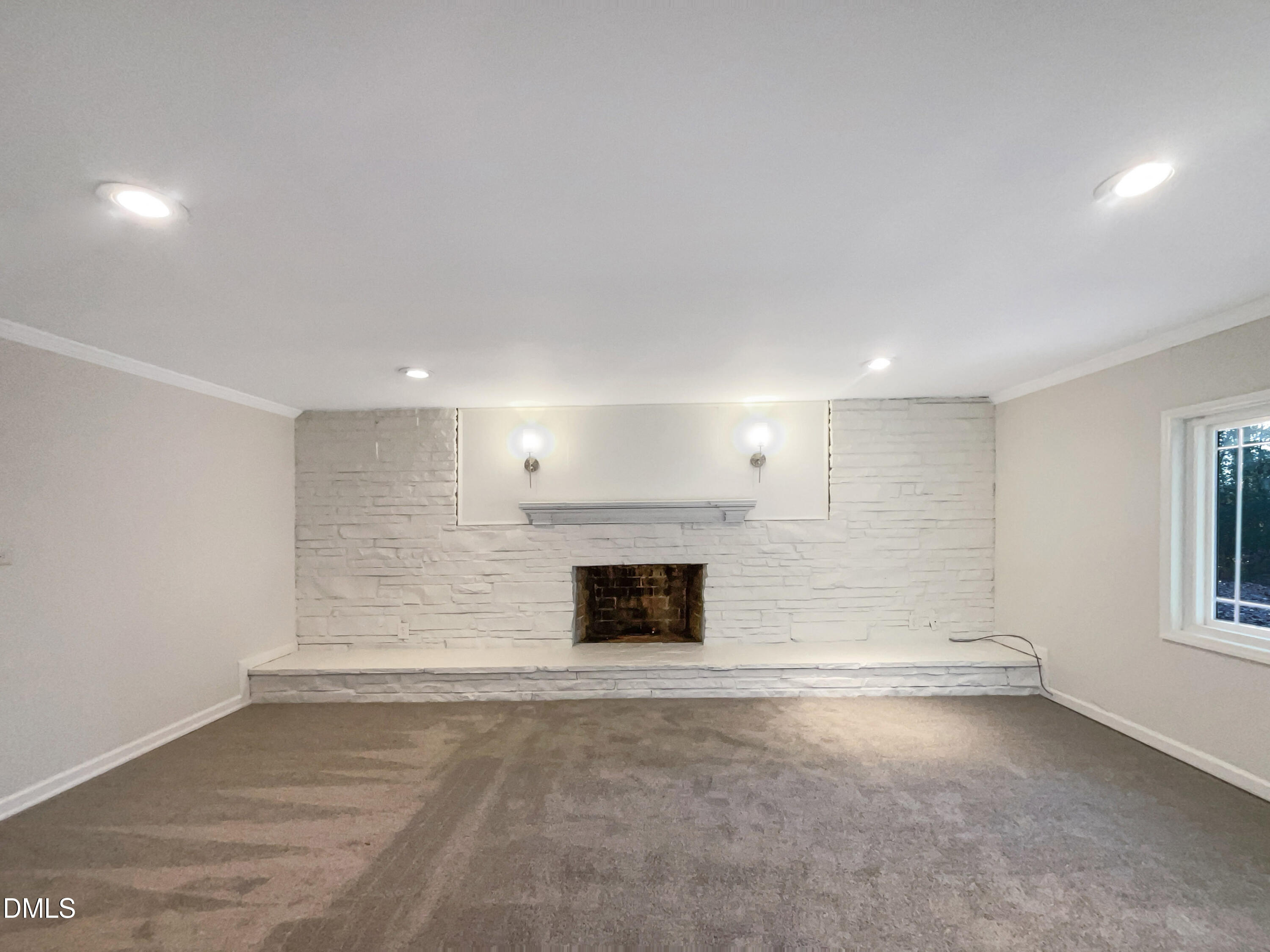 106 Foust Road Mebane, NC 27302 - Photo 3 of 18 an empty room with windows and fireplace