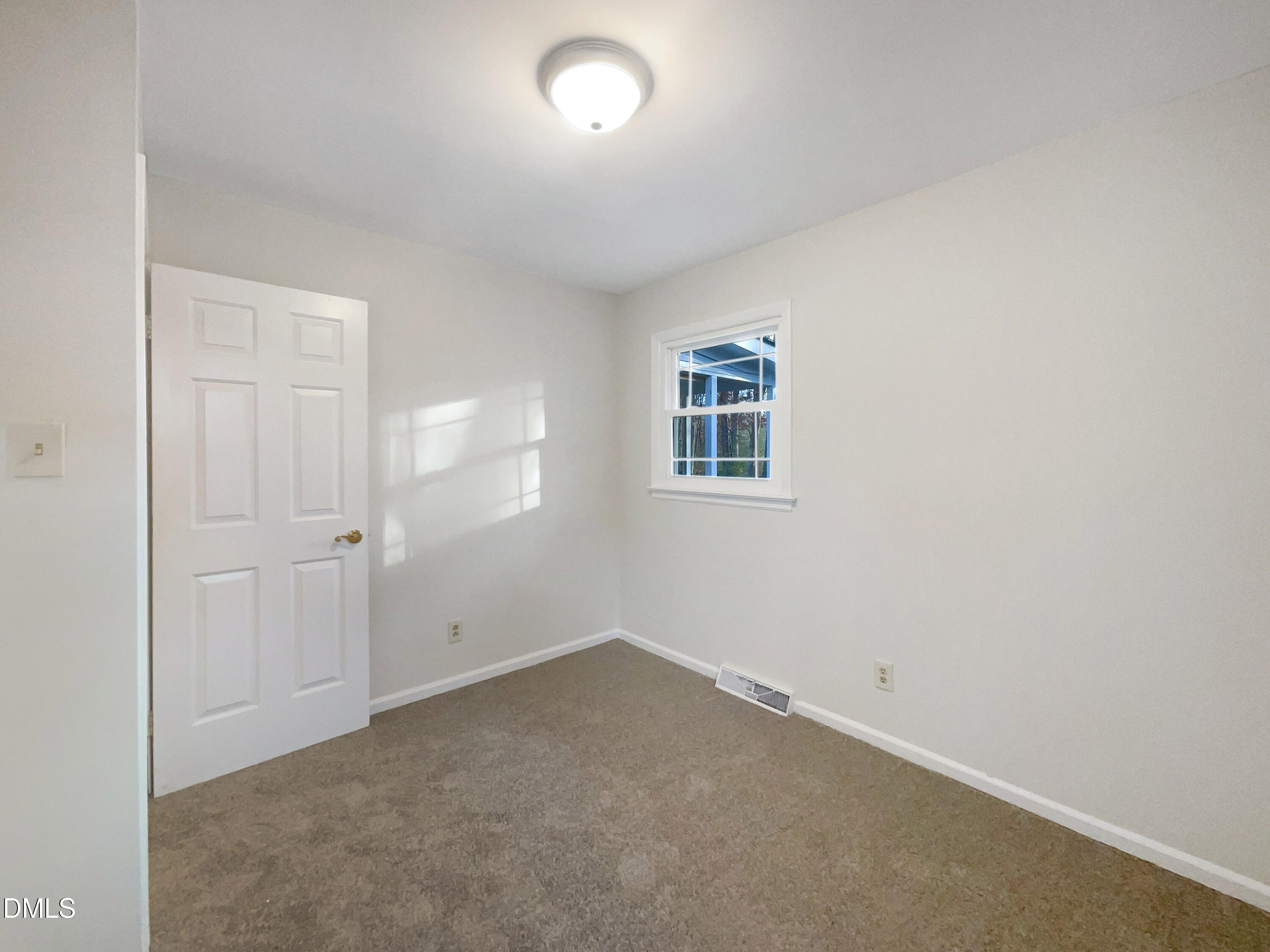 106 Foust Road Mebane, NC 27302 - Photo 4 of 18 an empty room with windows