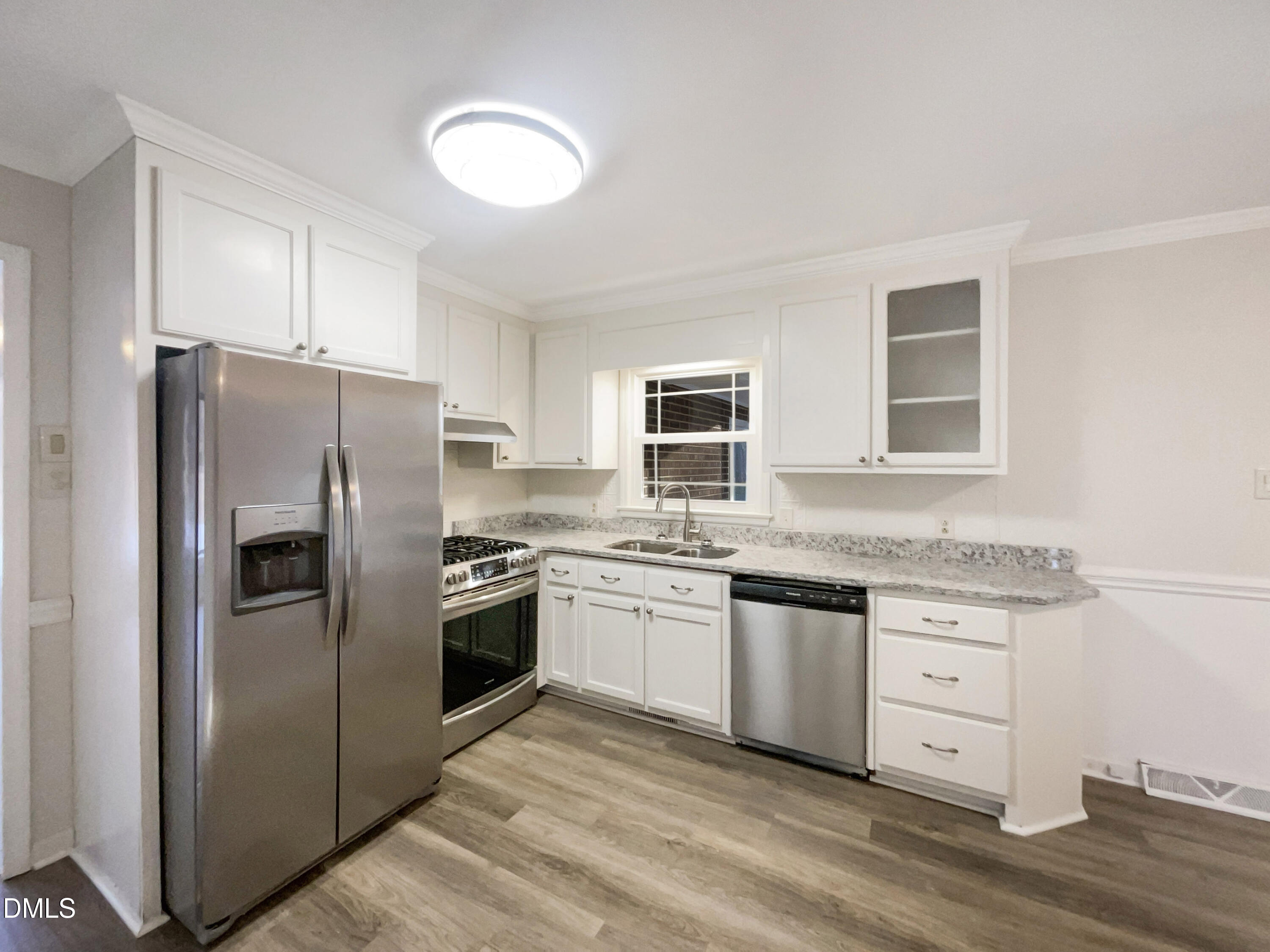 106 Foust Road Mebane, NC 27302 - Photo 8 of 18 a kitchen with stainless steel appliances granite countertop a refrigerator and a stove top oven