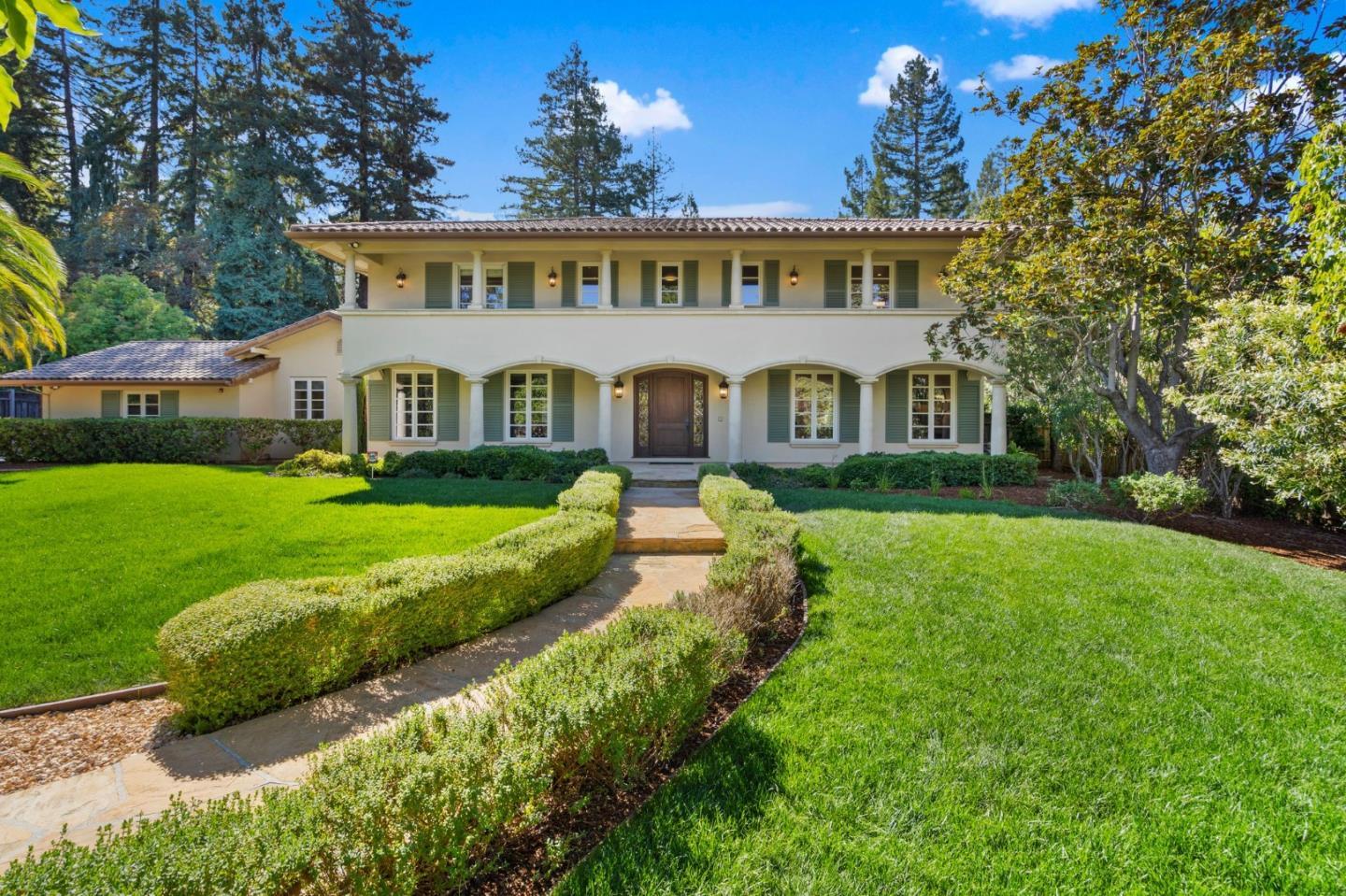 a view of house with a yard