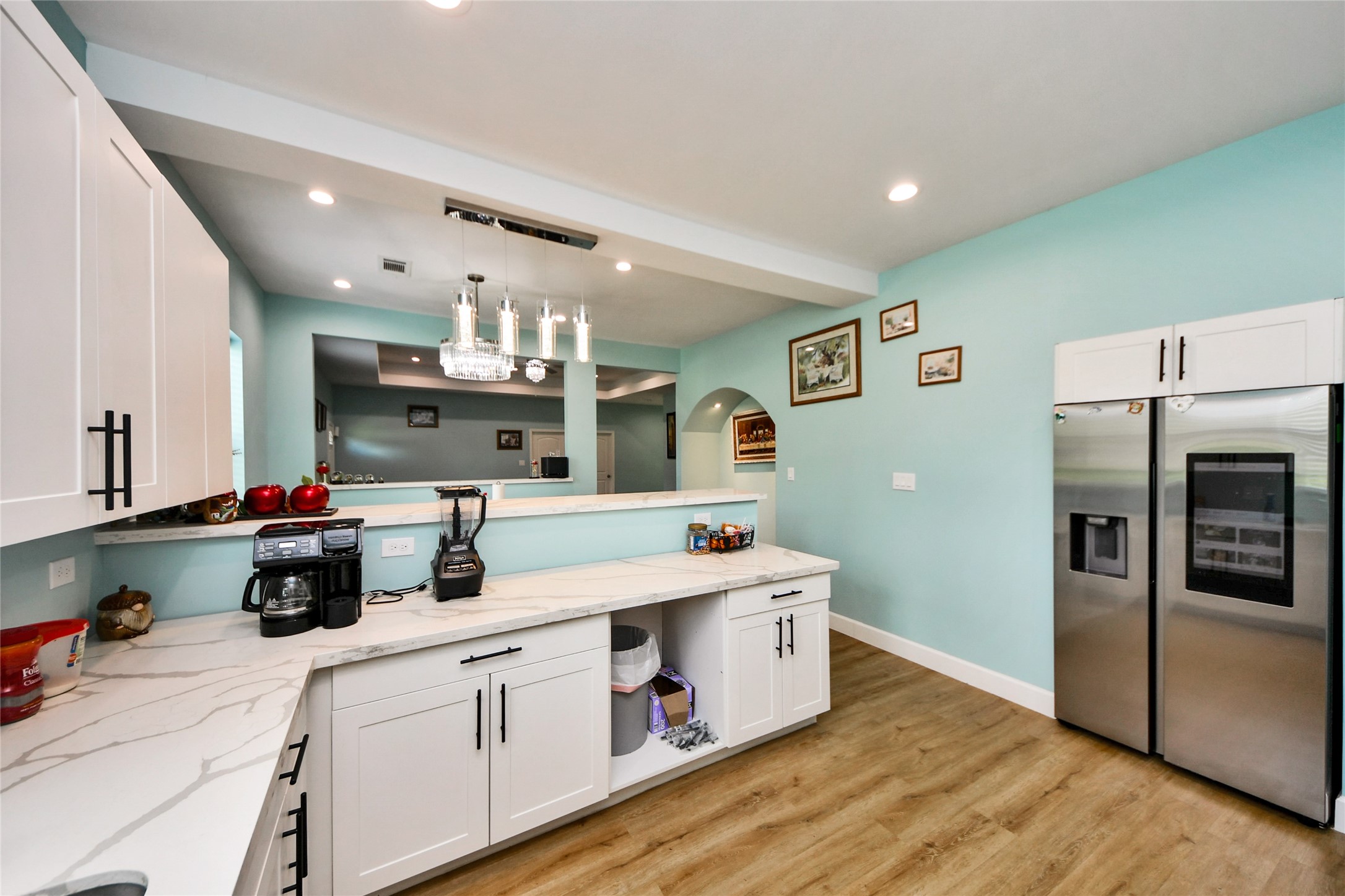 12128 County Road Cleveland, TX 77327 - Photo 11 of 27 a kitchen with stainless steel appliances a sink cabinets and wooden floor