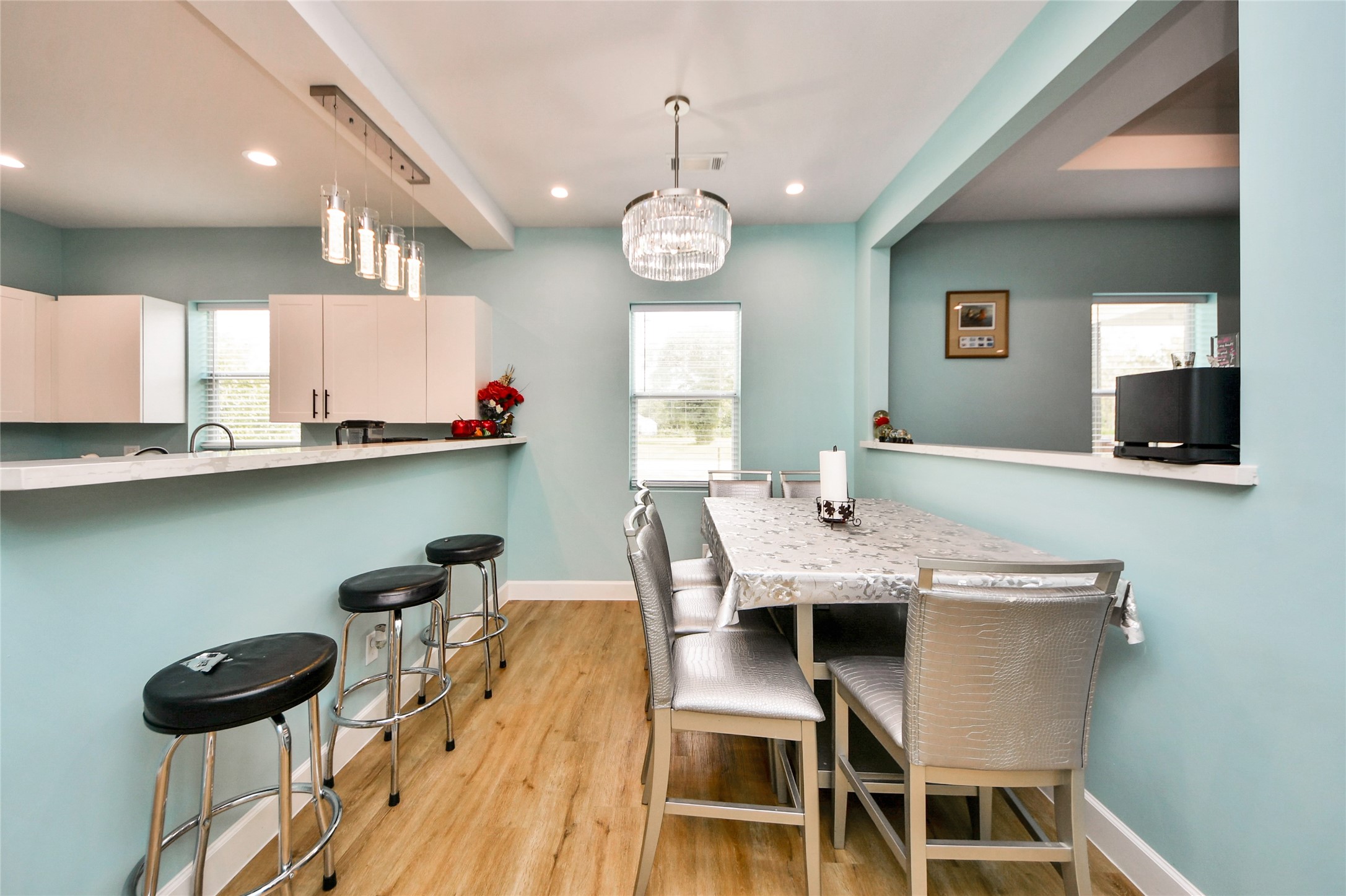 12128 County Road Cleveland, TX 77327 - Photo 12 of 27 a view of a dining room with furniture and a large window