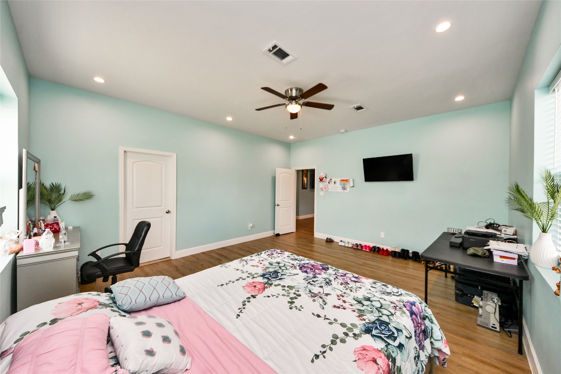 12128 County Road Cleveland, TX 77327 - Photo 15 of 27 a bedroom with a bed and a tv