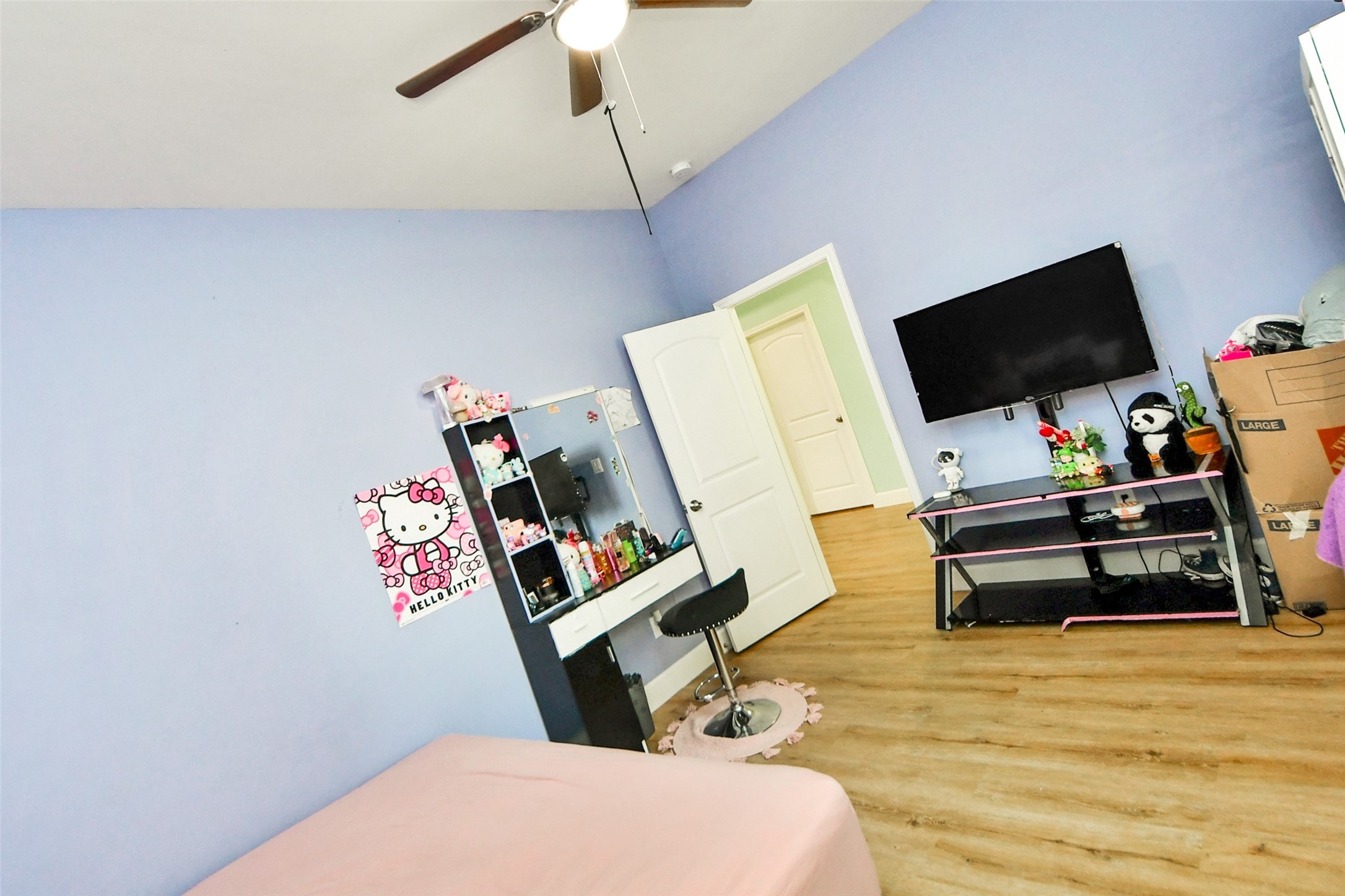 12128 County Road Cleveland, TX 77327 - Photo 17 of 27 a bedroom with bed and a flat screen tv