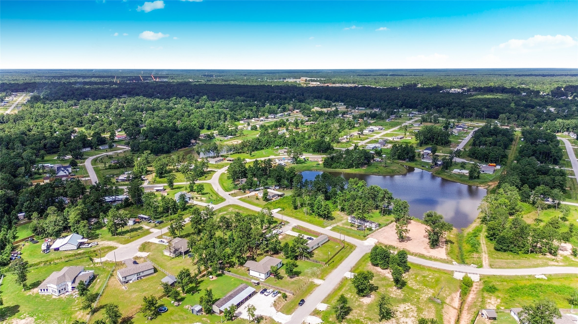 12128 County Road Cleveland, TX 77327 - Photo 27 of 27 a view of lake and mountain
