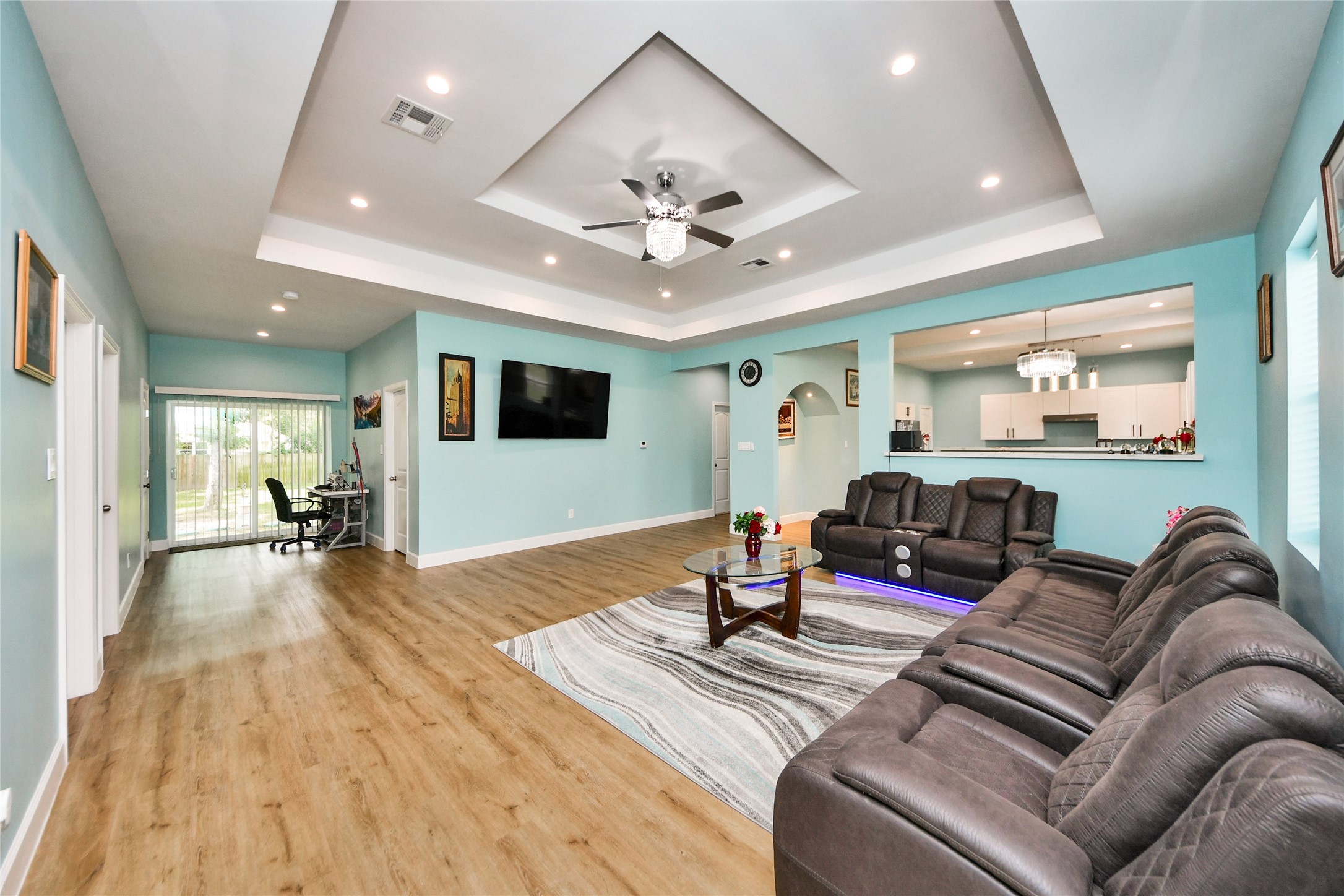 12128 County Road Cleveland, TX 77327 - Photo 5 of 27 a living room with furniture and a flat screen tv
