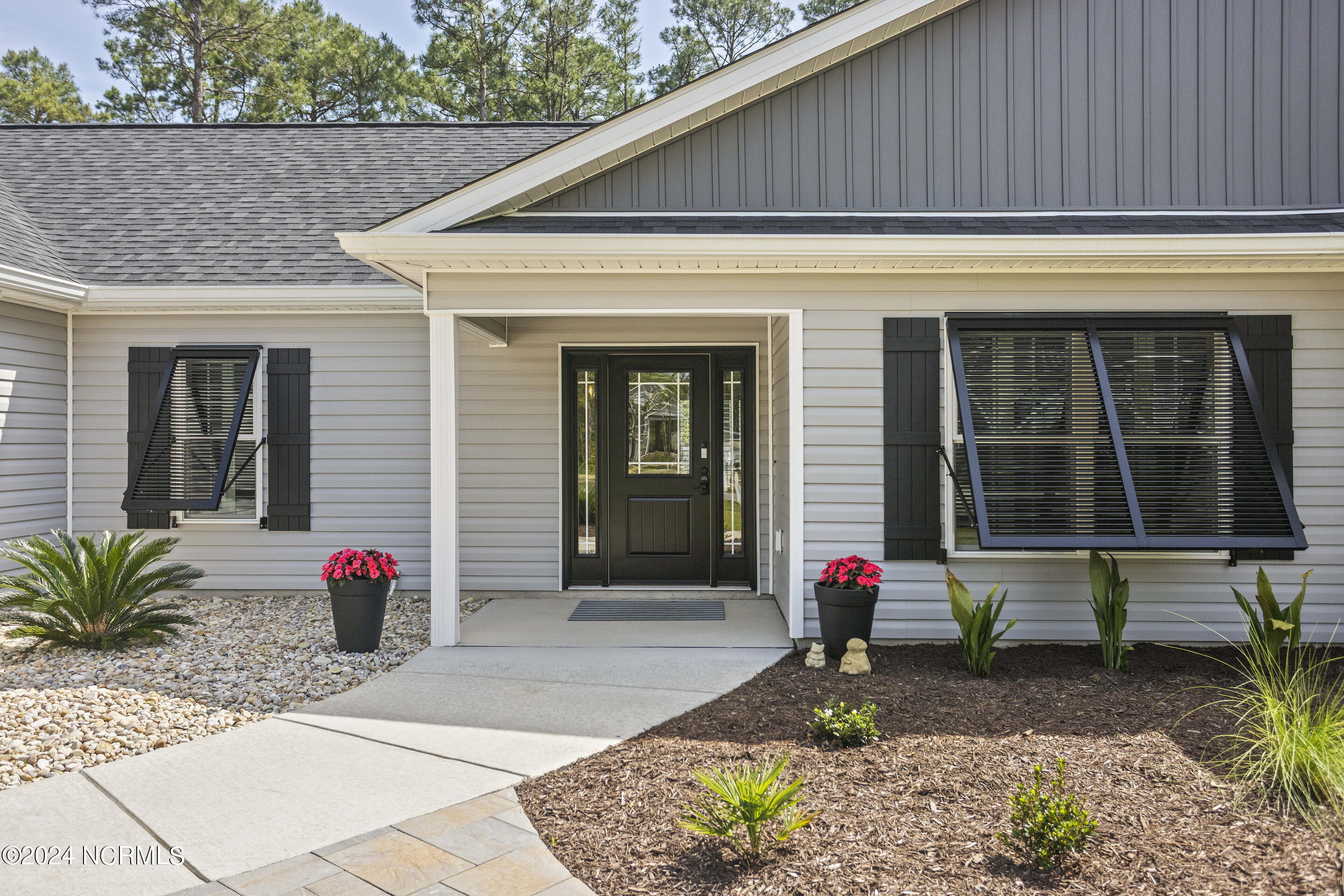 199 Boundary Loop Road Northwest Calabash, NC 28467 - Photo 6 of 45 Functional hurricane shutters