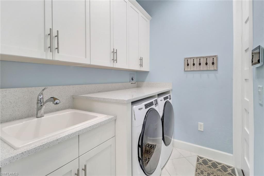 6509 Dominica Drive, Unit 101 Naples, FL 34113 - Photo 20 of 33 a utility room with dryer and washer