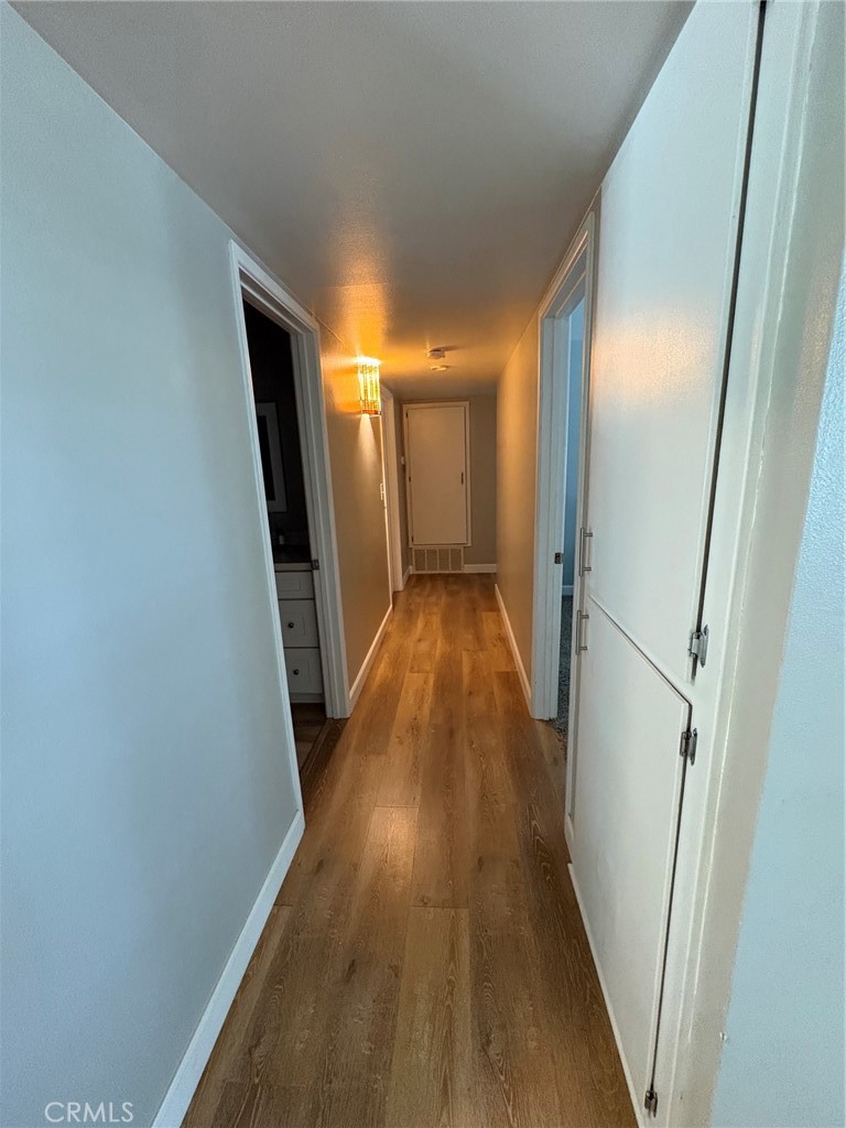 26378 Ridgemoor Road Menifee, CA 92586 - Photo 19 of 20 a view of a hallway with wooden floor