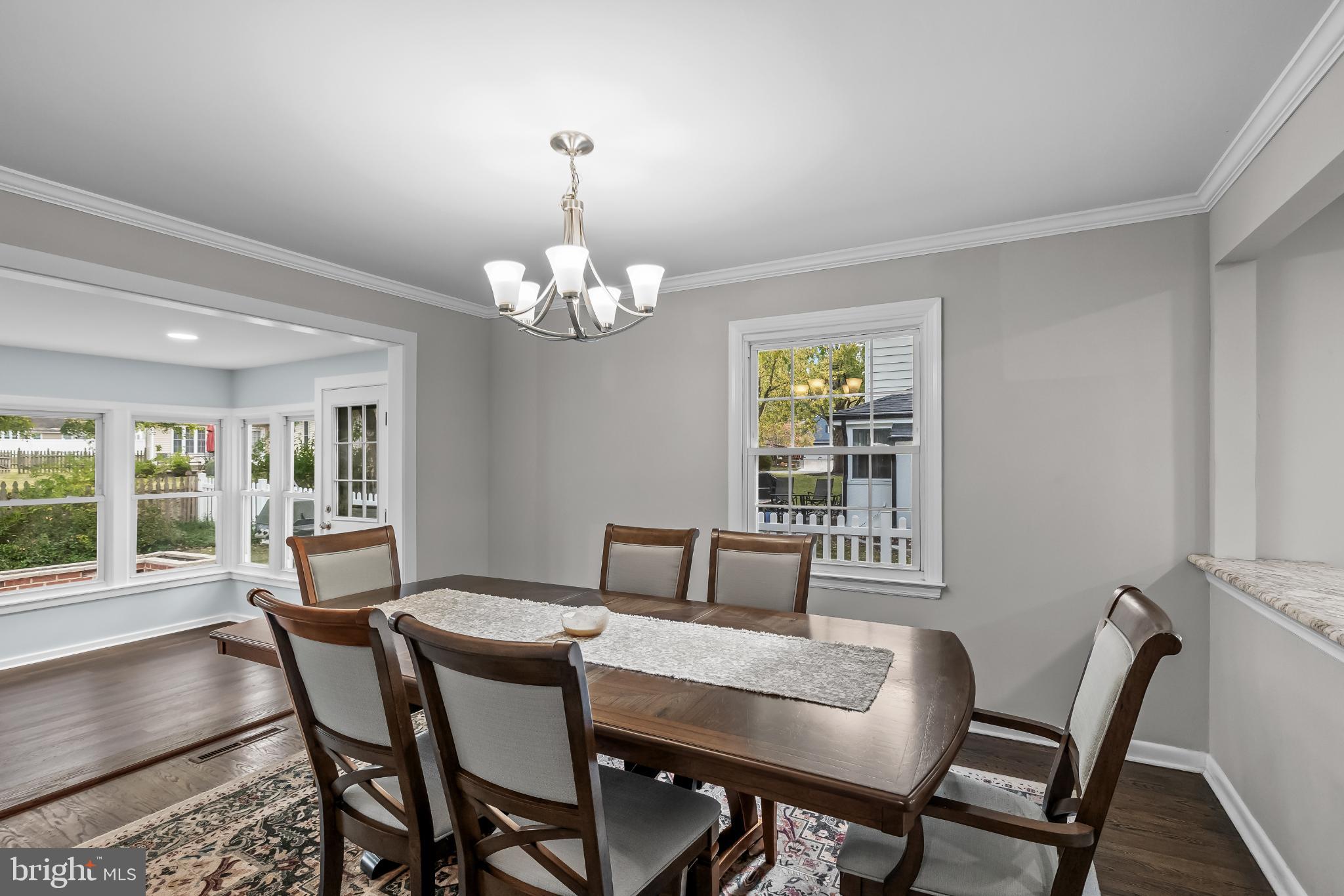 519 Tarrington Road Cherry Hill, NJ 08034 - Photo 8 of 30 a view of a dining room with furniture a chandelier and wooden floor