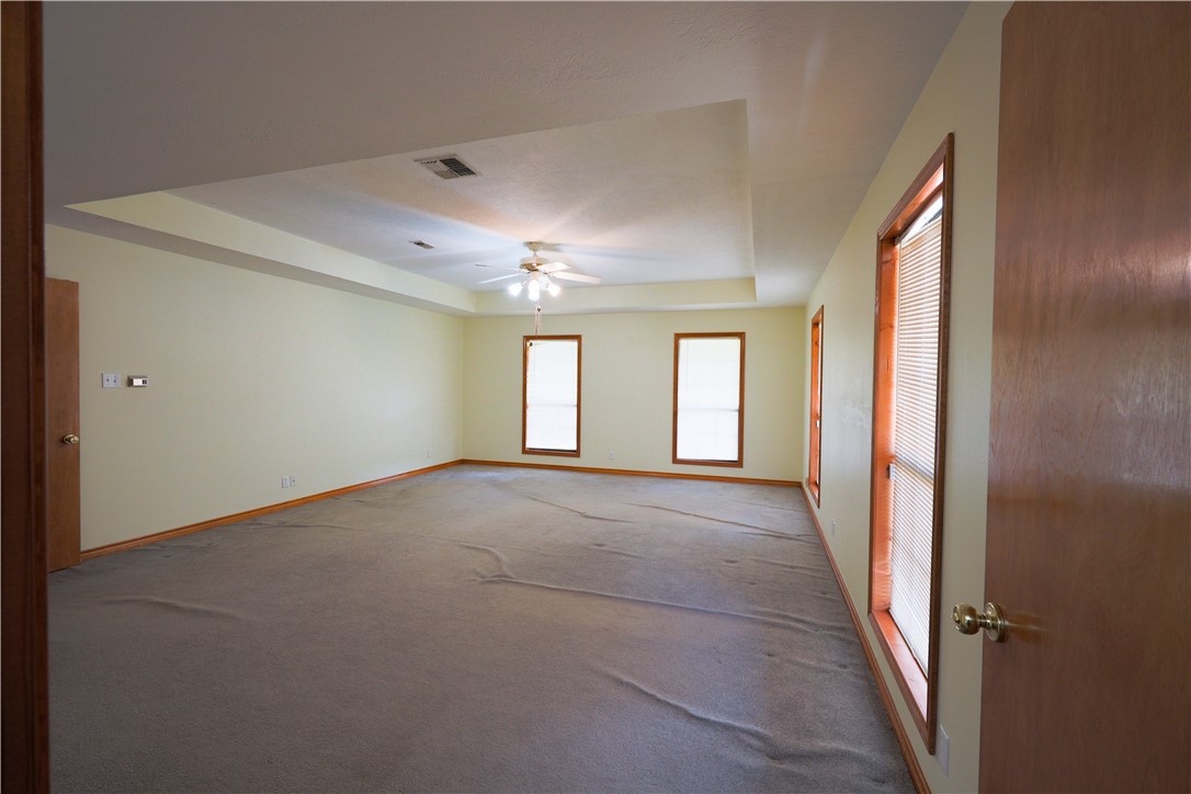 16403-16515 Macey Road Hearne, TX 77859 - Photo 29 of 46 a view of a big room with windows and chandelier