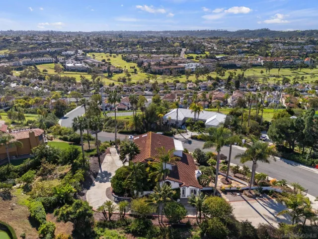a kitchen with a refrigerator sink and cabinets