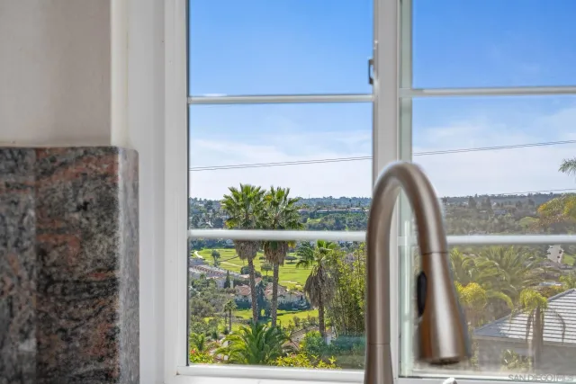 a view of a backyard with sitting area