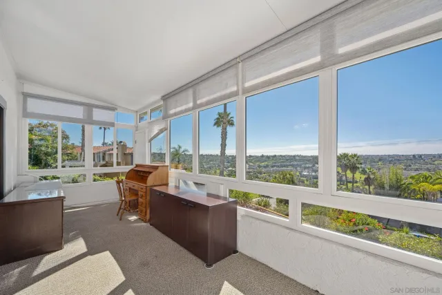 a dining room with furniture wooden floor and a chandelier
