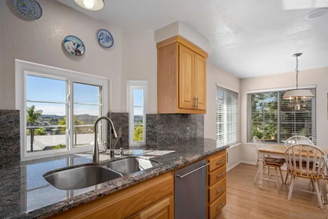 a living room with furniture a fireplace and a window