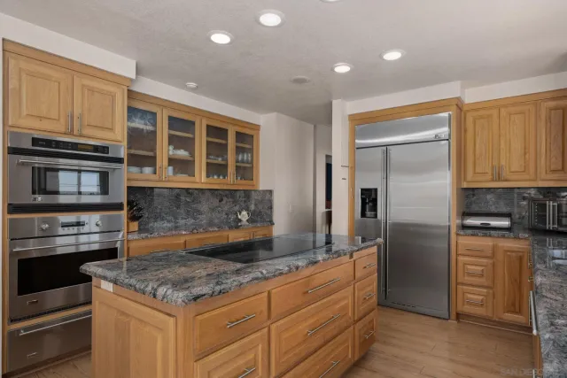 a room with a large window and a table chair