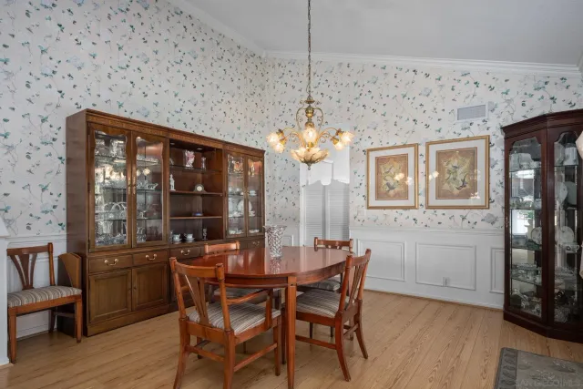 a spacious bathroom with a granite countertop sink and a mirror