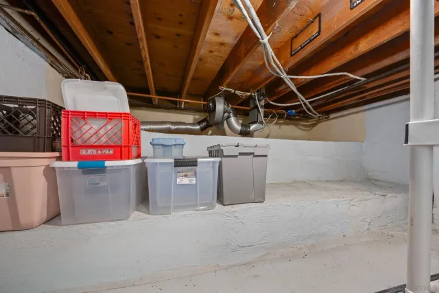 a bedroom with a bed and a desk