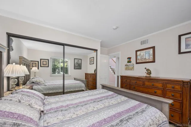 a living room with furniture a fireplace and a window