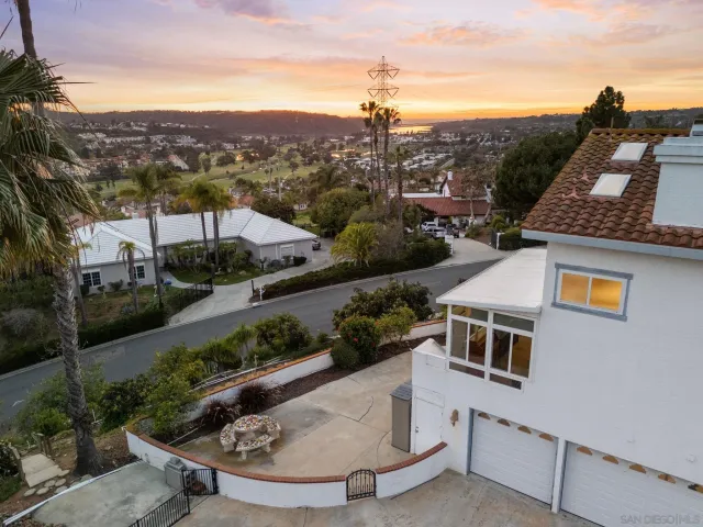 a front view of a house with a yard and a garage