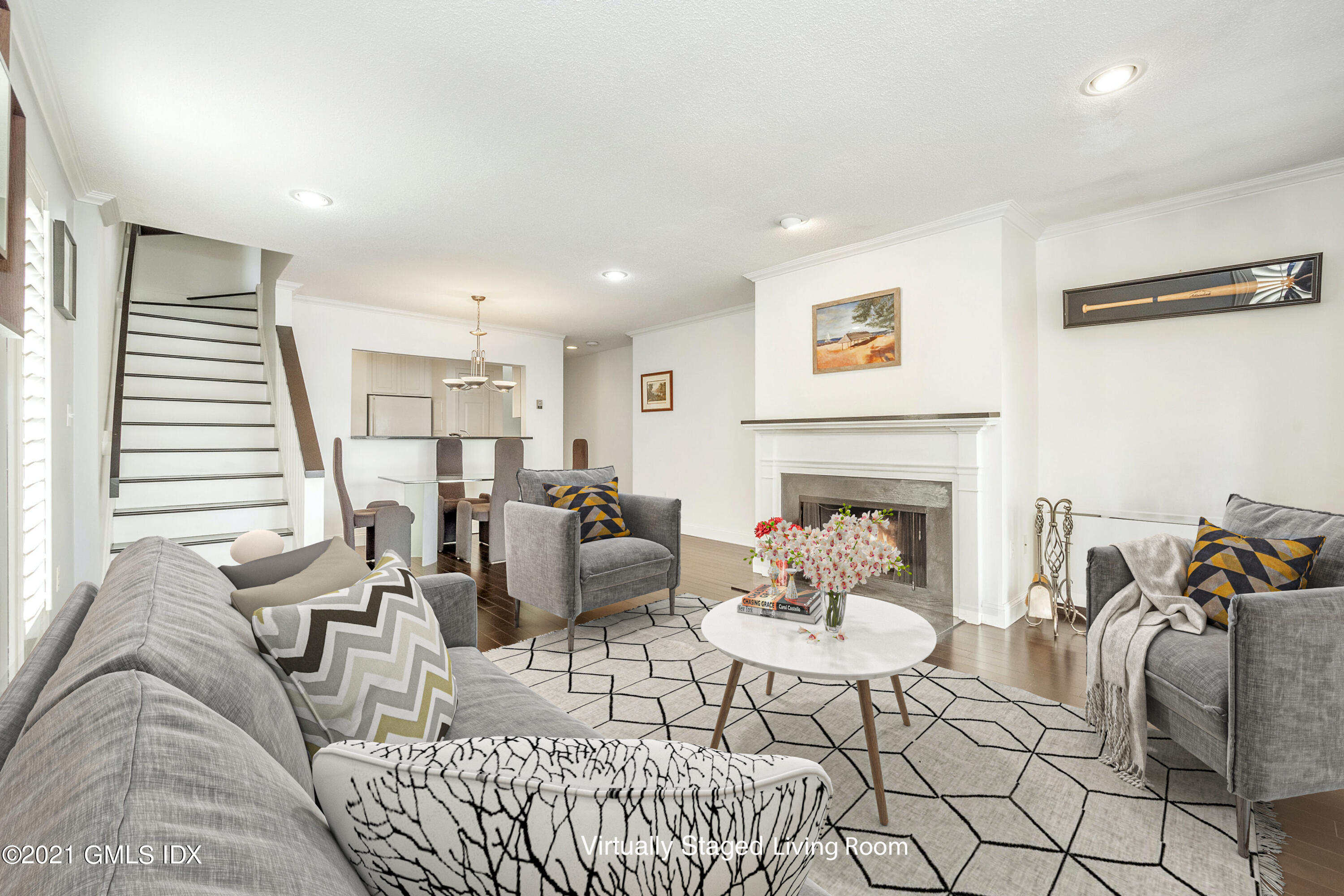 7 River Road, Unit 303 Cos Cob, CT 06807 - Photo 3 of 20 a living room with furniture and a fireplace