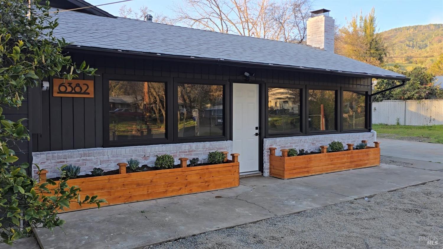 an outdoor view of house with outdoor seating
