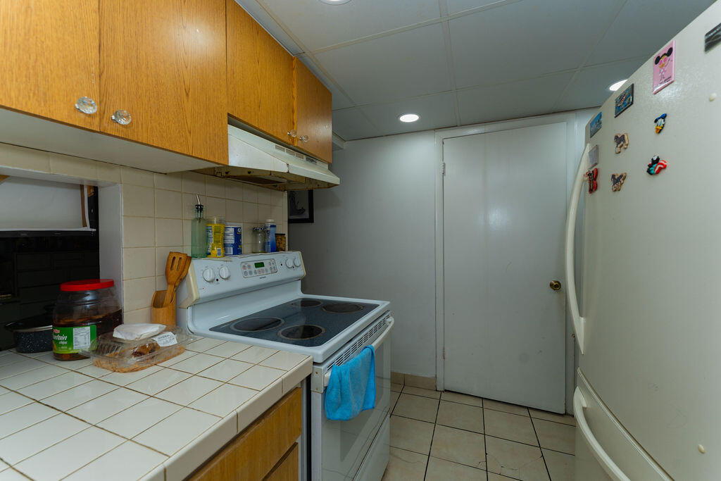 777 Southwest 9th Avenue, Unit 409 Miami, FL 33130 - Photo 14 of 32 a kitchen that has a sink and a stove in it