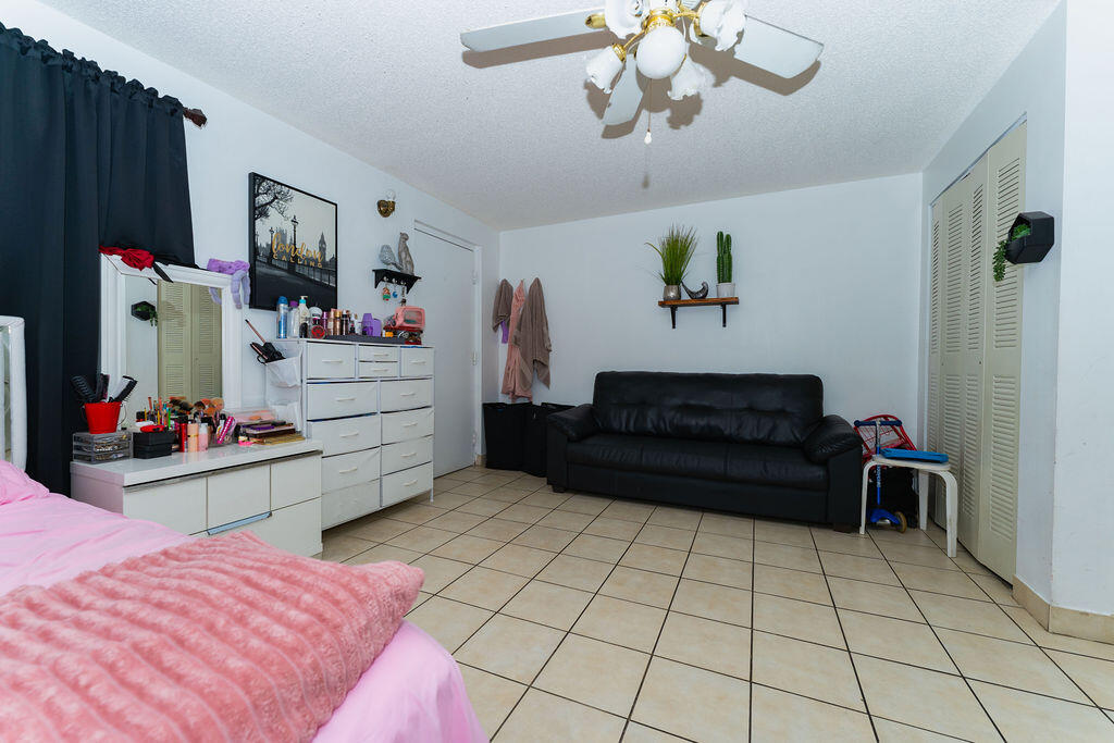 777 Southwest 9th Avenue, Unit 409 Miami, FL 33130 - Photo 23 of 32 a living room with furniture and a flat screen tv