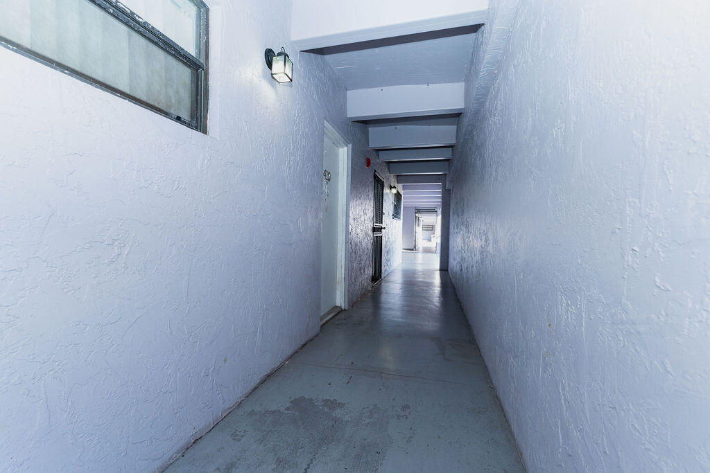 777 Southwest 9th Avenue, Unit 409 Miami, FL 33130 - Photo 27 of 32 a view of a hallway with wooden floor