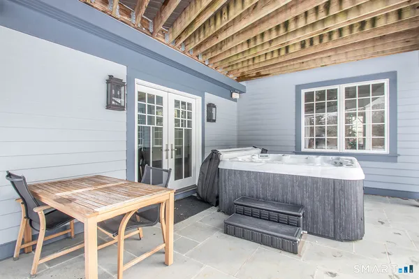 a view of a dinning table and chairs in the patio