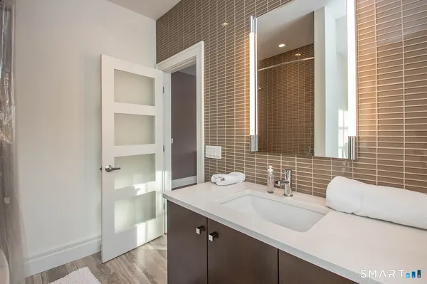 a bathroom with a sink and a mirror