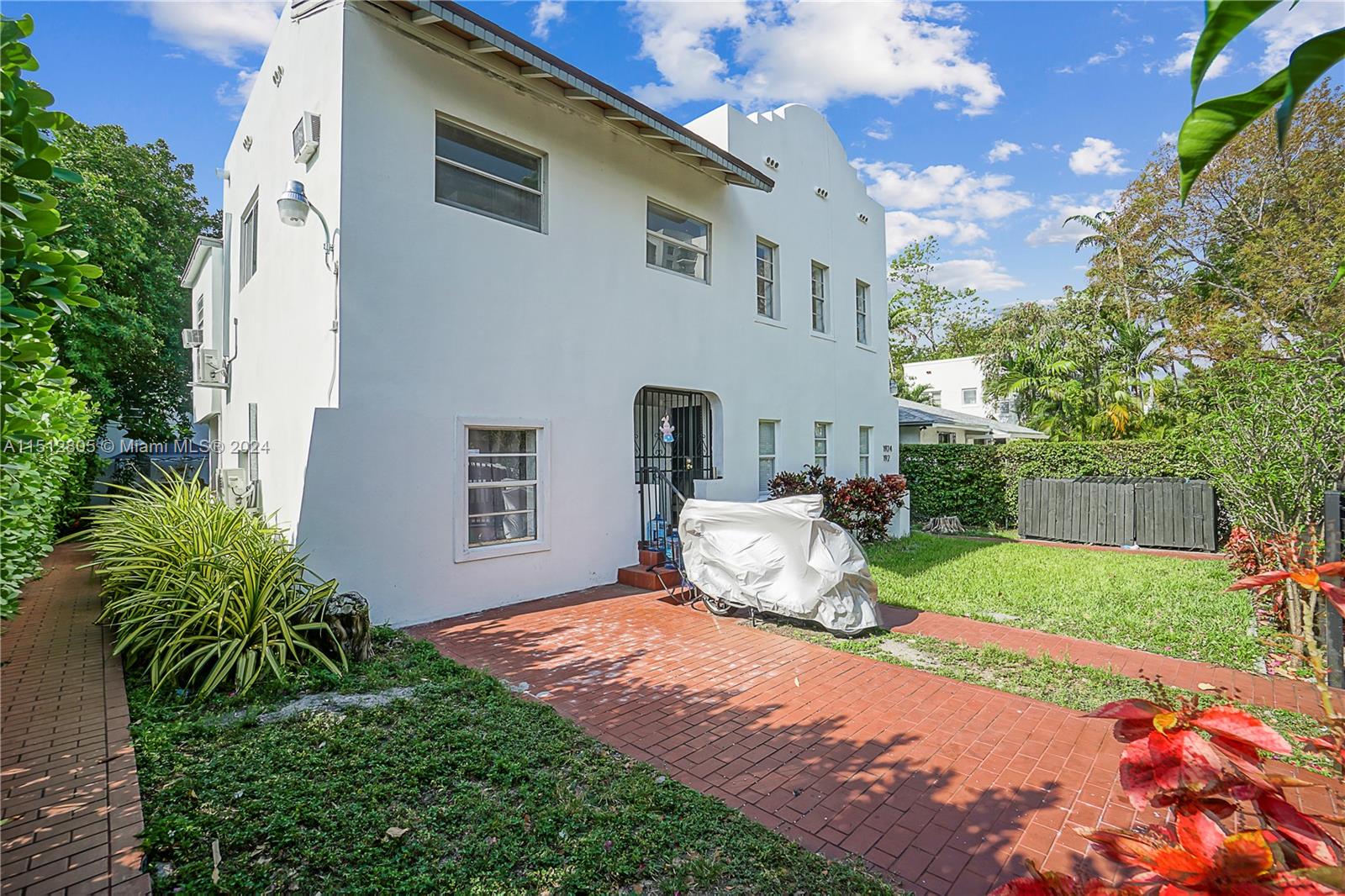1924 Southwest 9th Street Miami, FL 33135 - Photo 22 of 23 a front view of a house with a yard and porch