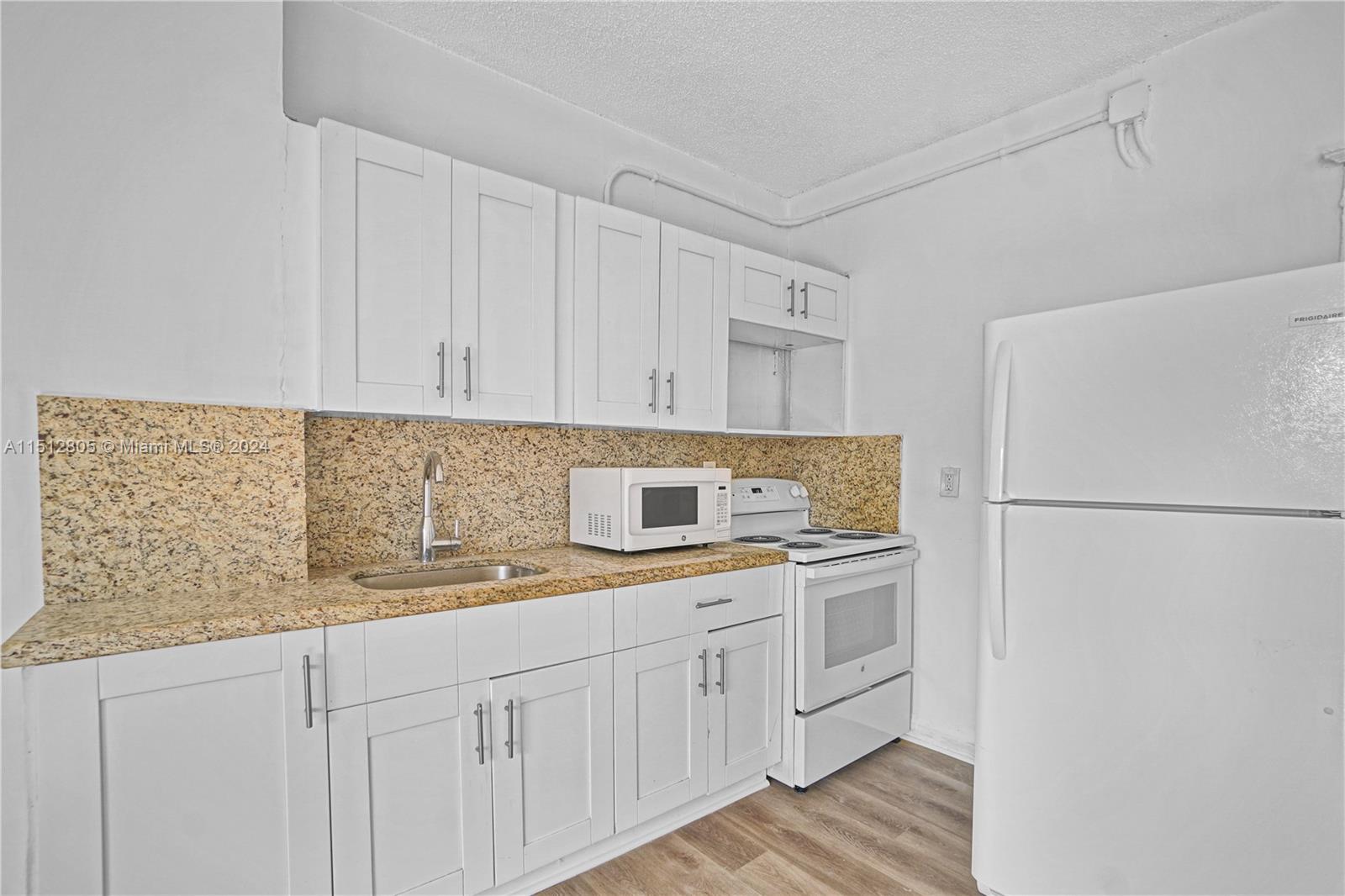 1924 Southwest 9th Street Miami, FL 33135 - Photo 9 of 23 a kitchen with a sink and cabinets