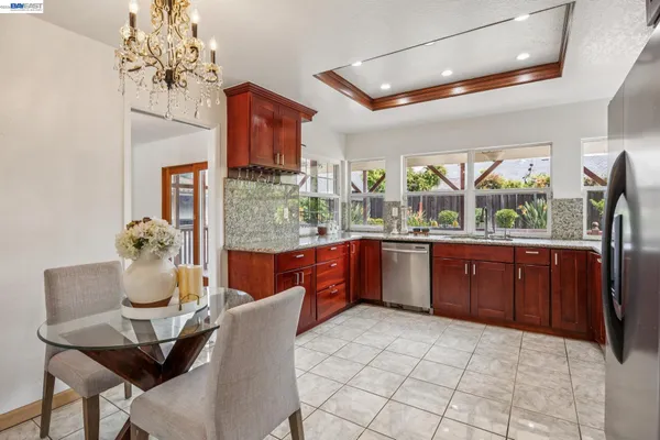 a kitchen with stainless steel appliances a sink and a refrigerator