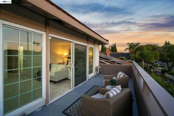 a view of balcony with furniture