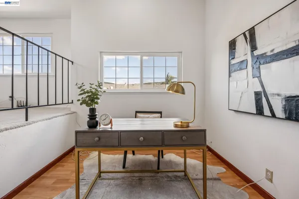 a bedroom with a table and chairs
