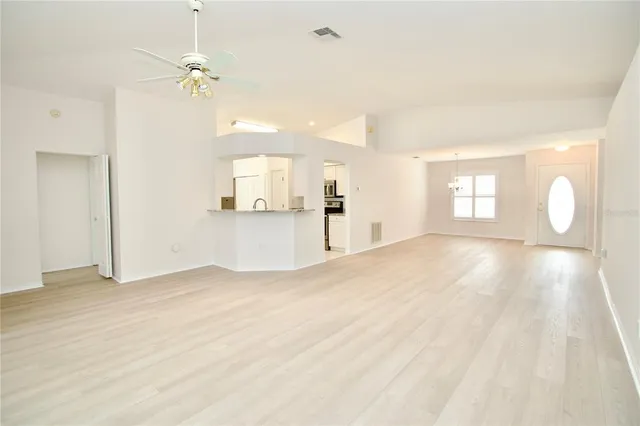 a kitchen with a stove a sink and a refrigerator
