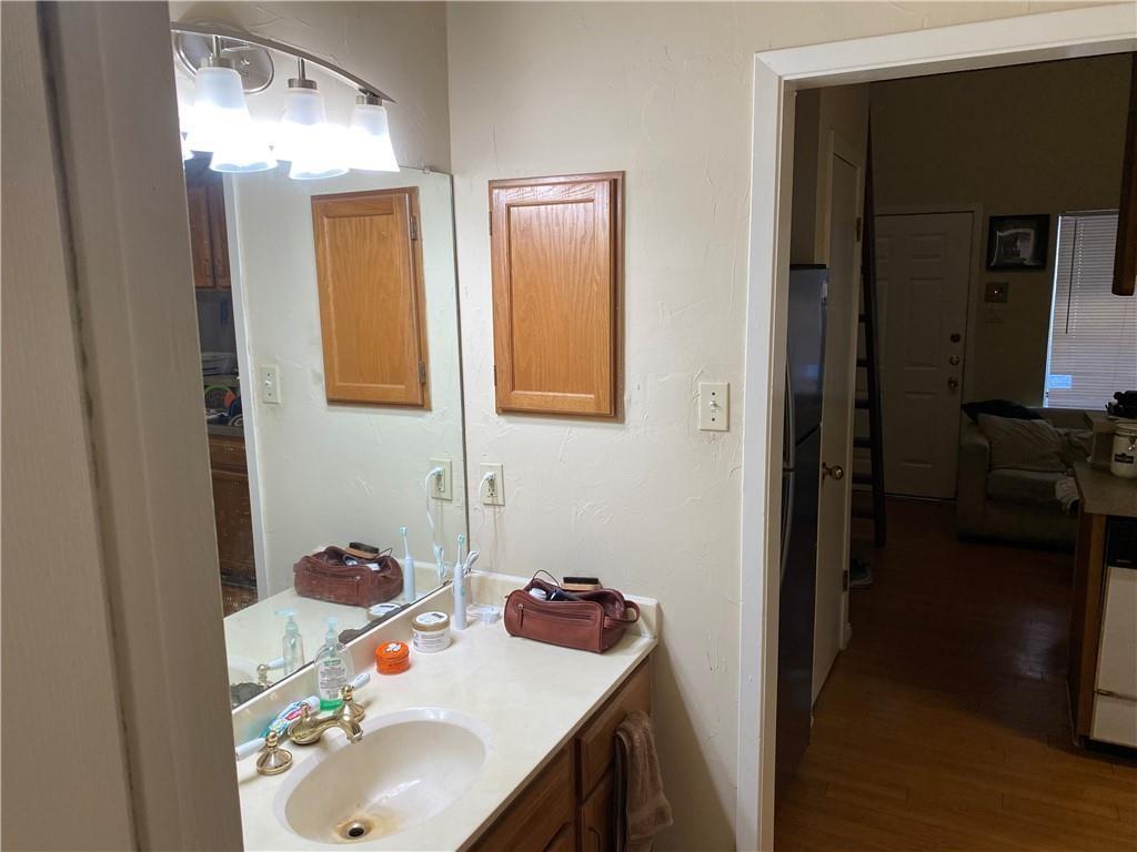 2815 Rio Grande Street, Unit 206 Austin, TX 78705 - Photo 3 of 6 a bathroom with a sink and a mirror