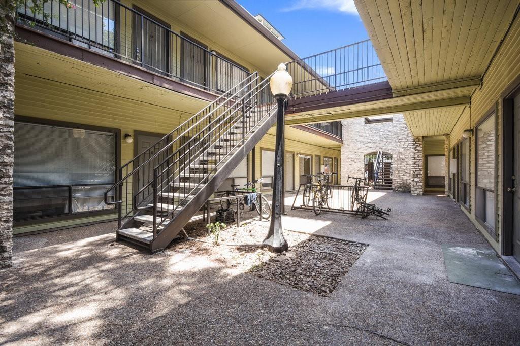 2815 Rio Grande Street, Unit 206 Austin, TX 78705 - Photo 4 of 6 a view of an empty room with stairs