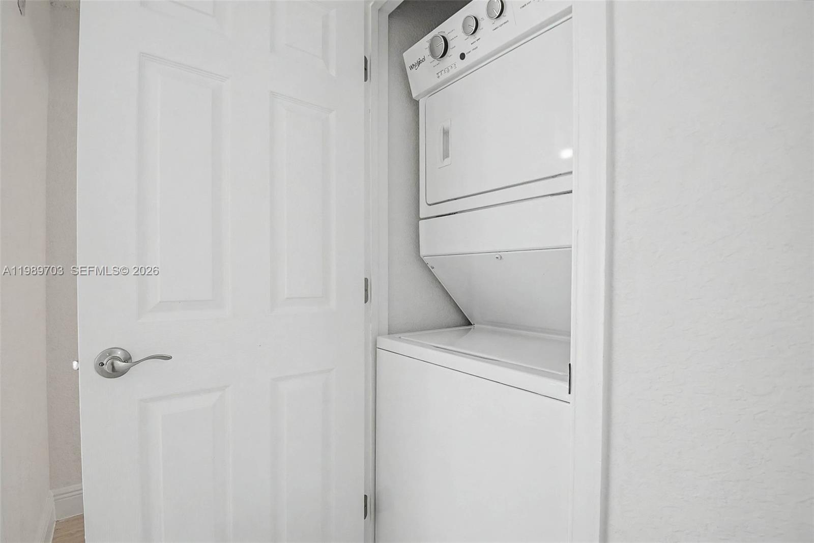 7000 Southwest 80th Street, Unit 103 Miami, FL 33143 - Photo 12 of 16 a utility room with dryer and washer
