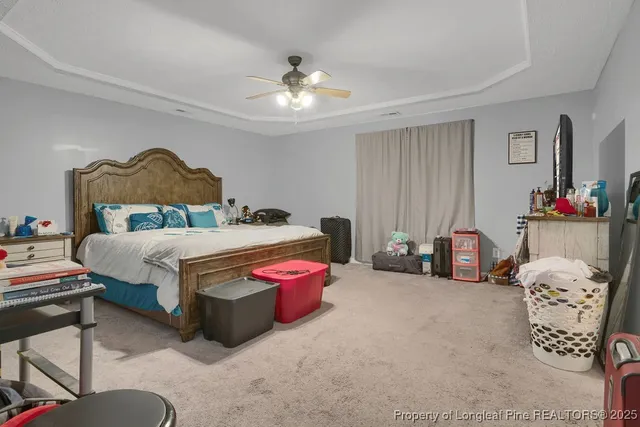 a bed room with a bed and a chandelier