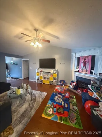 a living room with furniture and a flat screen tv