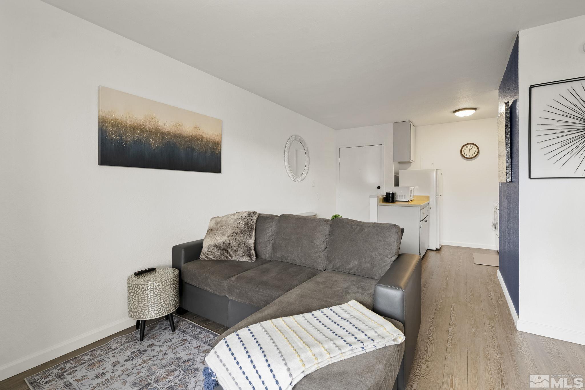 2450 Lymbery Street, Unit 214 Reno, NV 89509 - Photo 2 of 13 a living room with furniture and a flat screen tv