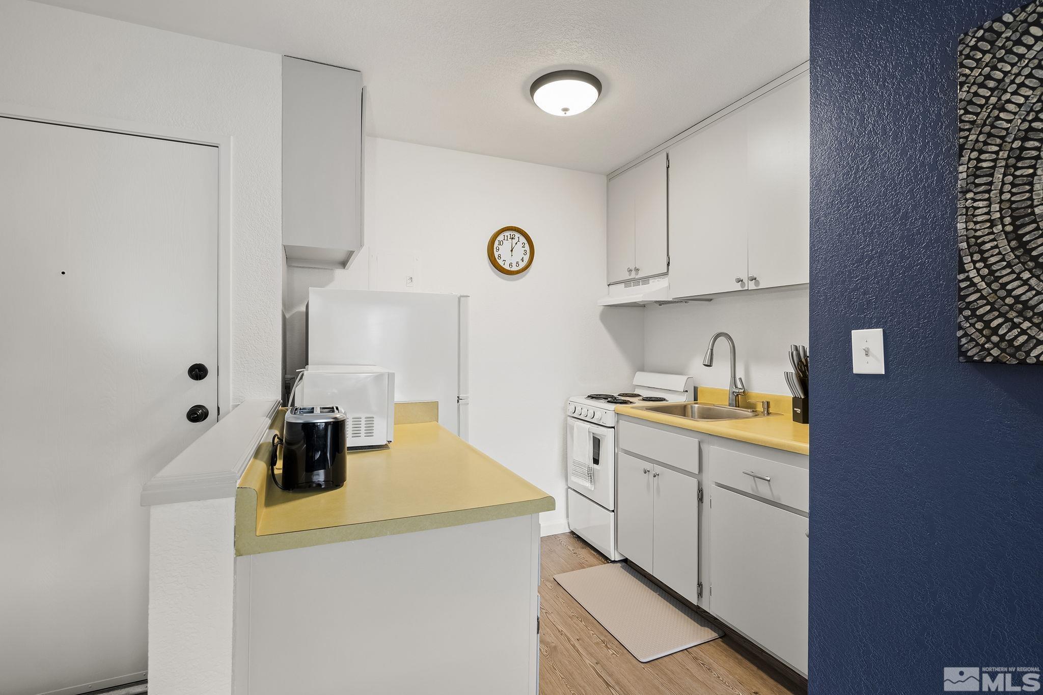 2450 Lymbery Street, Unit 214 Reno, NV 89509 - Photo 6 of 13 a view of a kitchen with a sink and cabinets