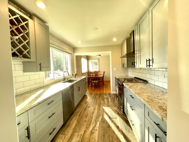 740 Summit Road Lake Zurich, IL 60047 - Photo 17 of 35 a large kitchen with a lot of counter space and a wooden floor