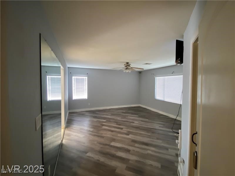 1154 Warm Sun Court Las Vegas, NV 89110 - Photo 16 of 19 Spare room featuring dark wood finished floors and ceiling fan