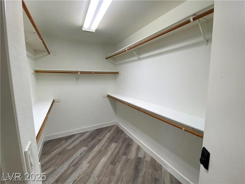 1154 Warm Sun Court Las Vegas, NV 89110 - Photo 10 of 19 Walk in closet featuring light wood finished floors