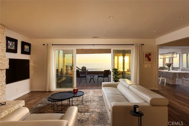 a living room with furniture tv and a fireplace