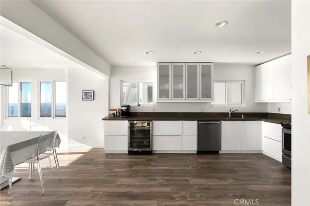 a kitchen with granite countertop a stove and a sink